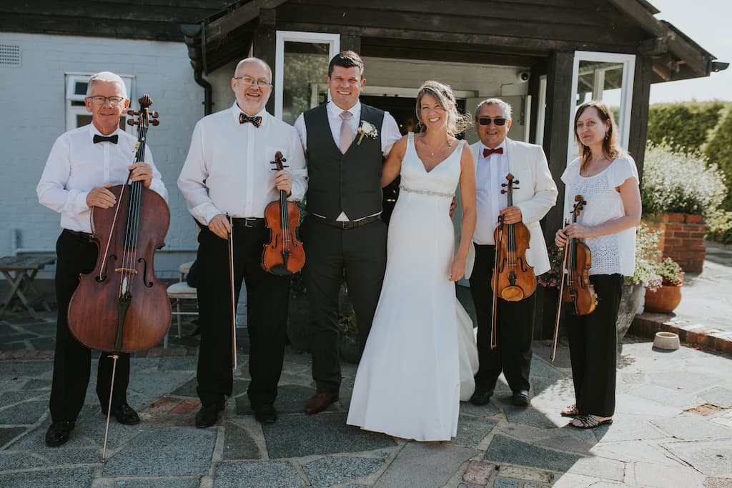 String quartet with happy couple at the Blazing Donkey